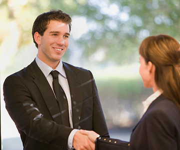 Co-workers shaking hands.